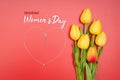 International WomenÃ¢â¬â¢s Day with flowers and heart shape necklace on red background Royalty Free Stock Photo